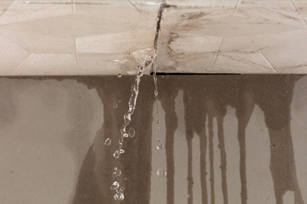 Professional Flood Damage Cleanup technician working in East Boston, MA